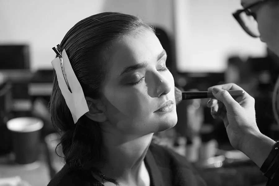 Backstage makeup artist working bw - fashion week 1